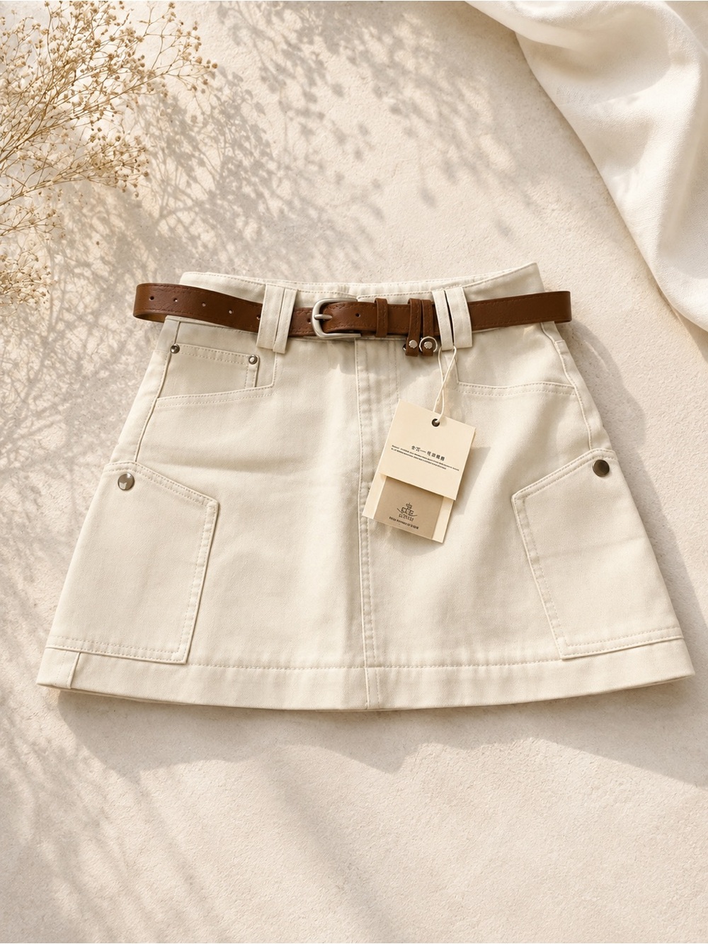 Que Cream Mini Skirt with Brown Belt